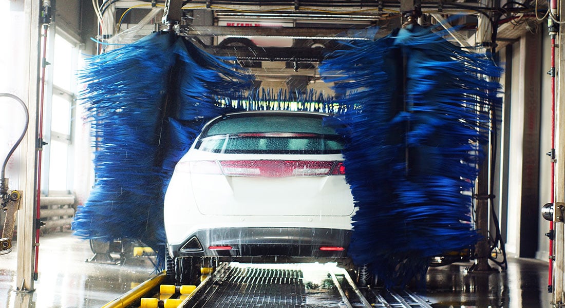 car going through carwash brushes