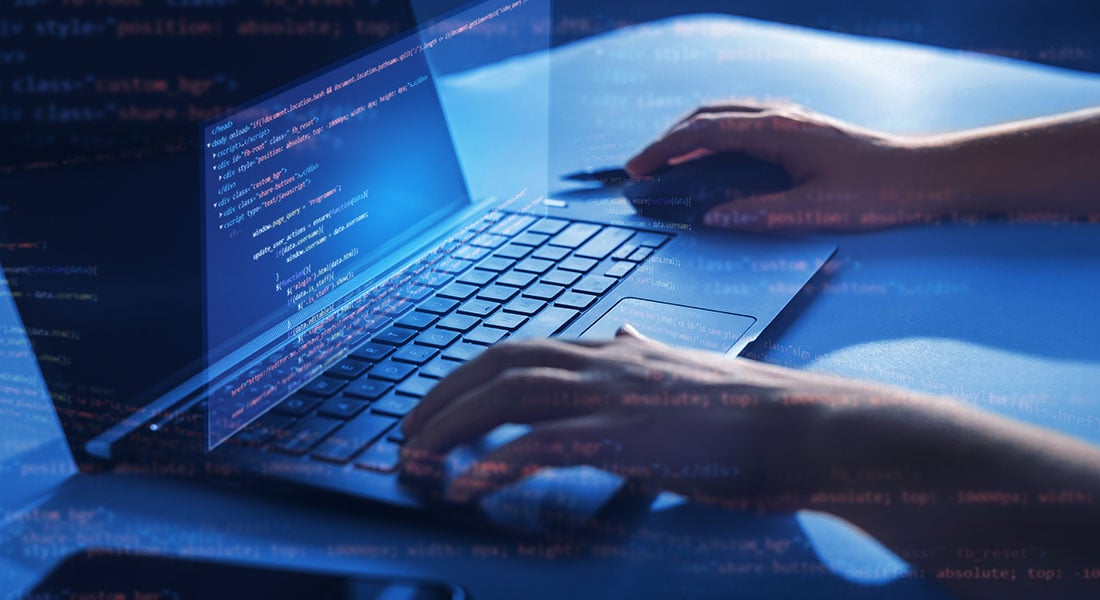 developer coding a payment integration on a laptop